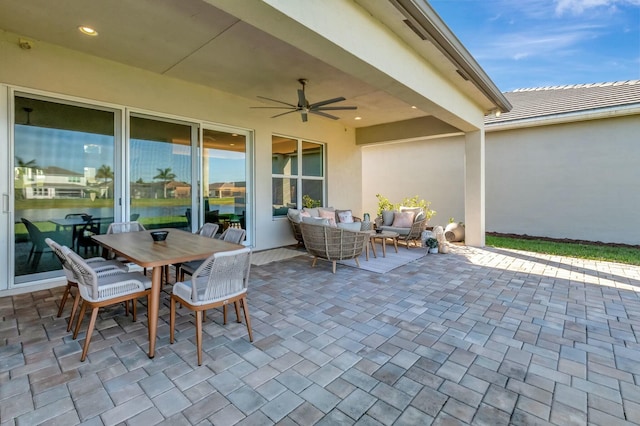 view of patio / terrace featuring outdoor lounge area, ceiling fan, and outdoor dining area