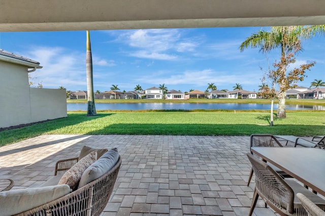 view of patio featuring a residential view and a water view
