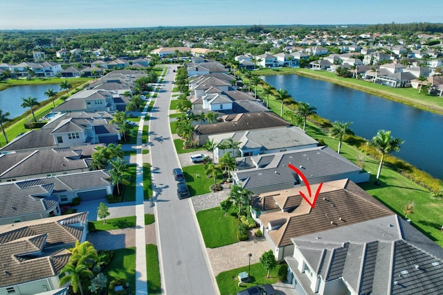 aerial perspective of suburban area featuring a nearby body of water