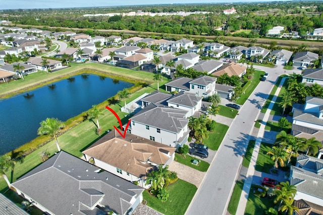 aerial view of residential area with a nearby body of water