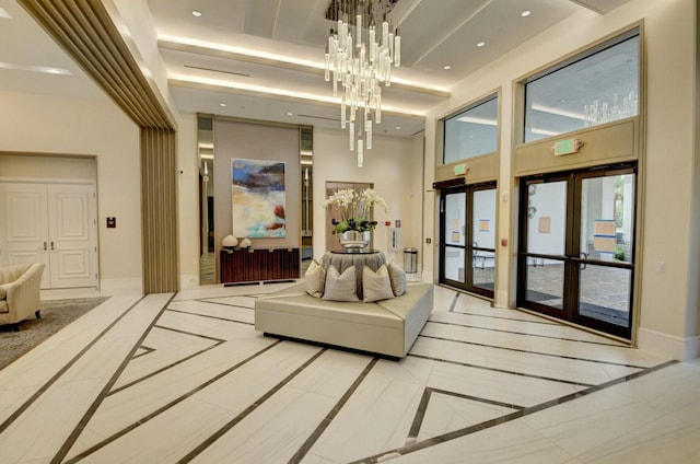 building lobby featuring recessed lighting and a high ceiling