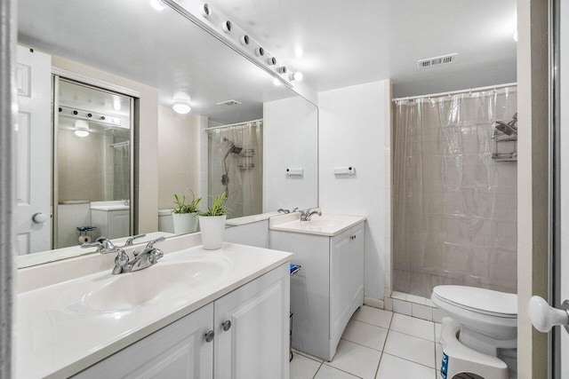 4059 Palm Bay Cir Unit C, West Palm Beach, FL 33406 - full bath with tile patterned flooring, two vanities, toilet, and a tile shower