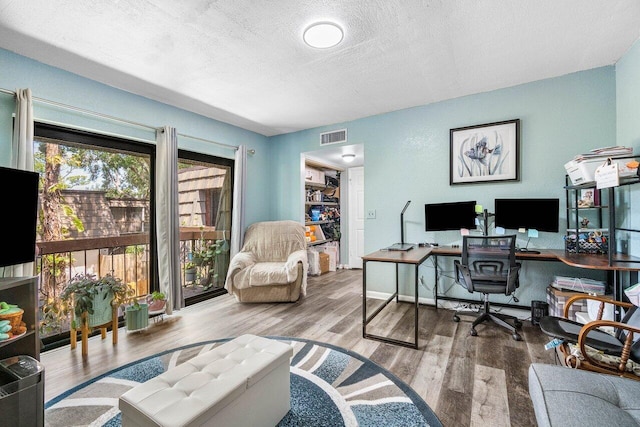 4059 Palm Bay Cir Unit C, West Palm Beach, FL 33406 - office area featuring a textured ceiling and wood finished floors