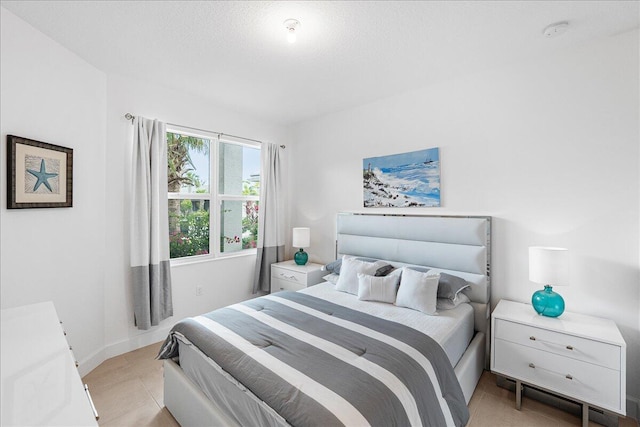 13339 SW River Rock Rd, Port Saint Lucie, FL 34987 - bedroom featuring a textured ceiling and light tile patterned floors