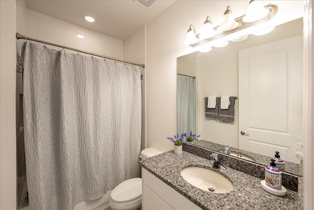 13339 SW River Rock Rd, Port Saint Lucie, FL 34987 - bathroom with vanity, toilet, and recessed lighting