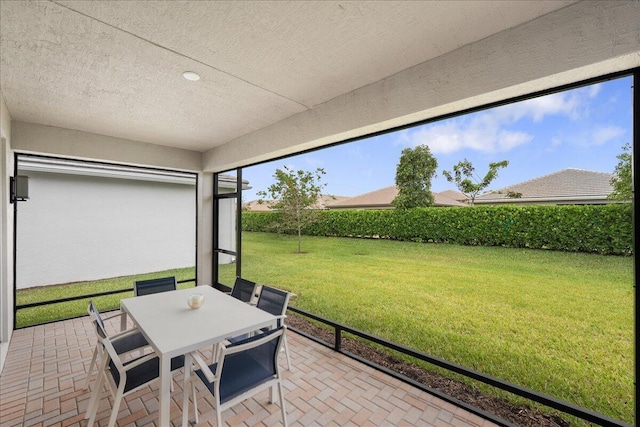 sunroom / solarium with outdoor dining space