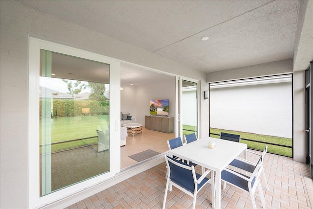 13339 SW River Rock Rd, Port Saint Lucie, FL 34987 - sunroom featuring outdoor dining space