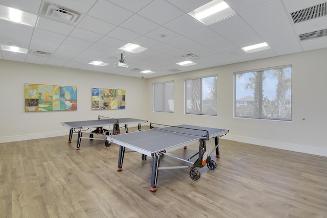 13339 SW River Rock Rd, Port Saint Lucie, FL 34987 - playroom with wood finished floors, a drop ceiling, and baseboards