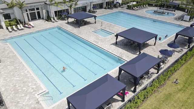 community pool featuring a gazebo and a patio