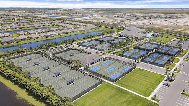 13339 SW River Rock Rd, Port Saint Lucie, FL 34987 - aerial perspective of suburban area with a large body of water