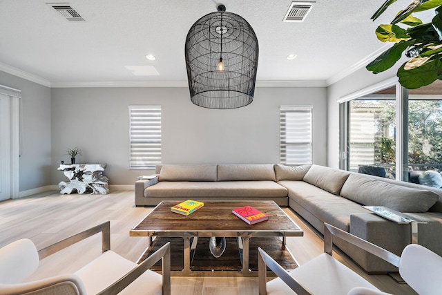 living room with plenty of natural light, wood finished floors, recessed lighting, crown molding, and baseboards