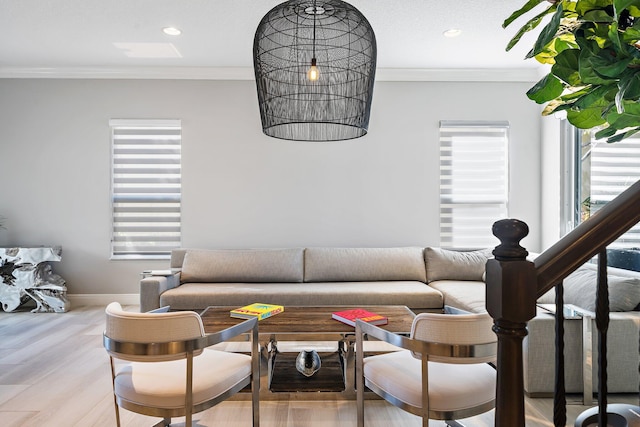 living area with ornamental molding, recessed lighting, baseboards, and wood finished floors