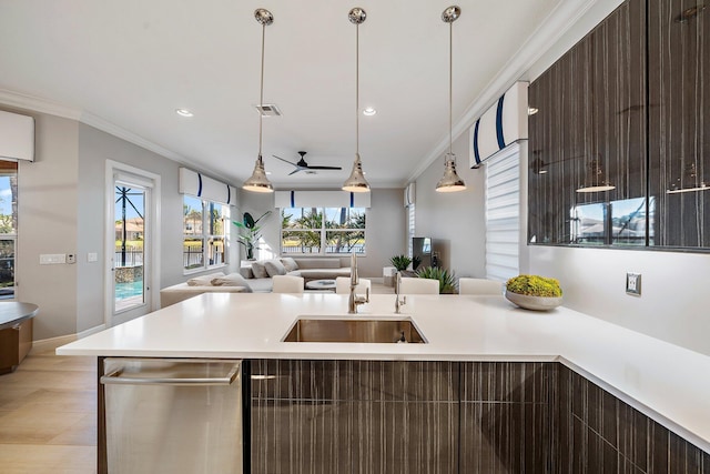 kitchen featuring modern cabinets, light countertops, dark brown cabinets, crown molding, and recessed lighting