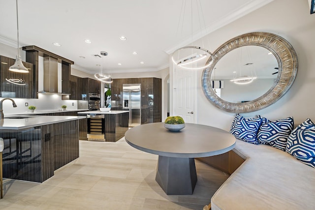 dining room featuring wine cooler, ornamental molding, recessed lighting, and light tile patterned flooring