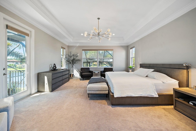 bedroom with light colored carpet, crown molding, access to exterior, a chandelier, and a raised ceiling