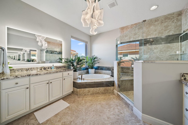 bathroom with a shower stall, a garden tub, and vanity