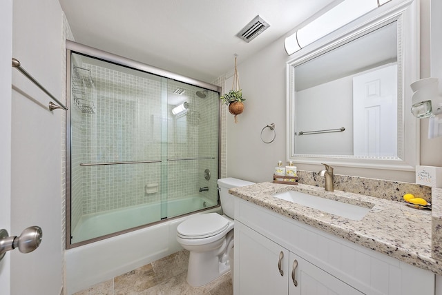 5393 SE Miles Grant Rd Unit A203, Stuart, FL 34997 - full bathroom with toilet, bath / shower combo with glass door, and vanity