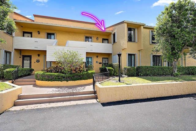 5393 SE Miles Grant Rd Unit A203, Stuart, FL 34997 - view of property featuring stucco siding
