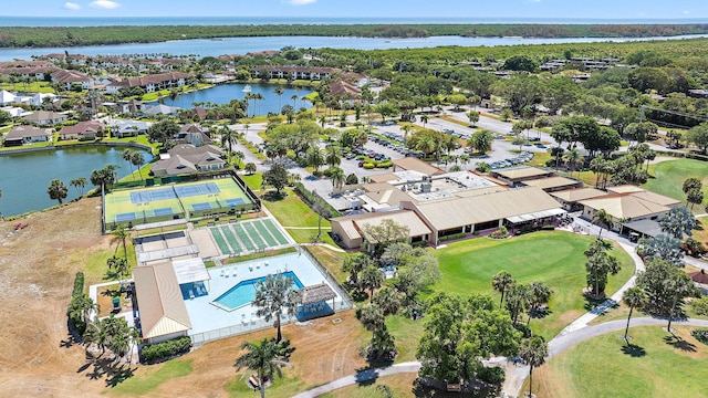 5393 SE Miles Grant Rd Unit A203, Stuart, FL 34997 - aerial view of residential area featuring a golf club, a large body of water, and a pool area