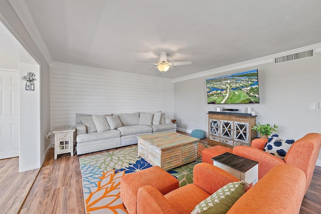 5393 SE Miles Grant Rd Unit A203, Stuart, FL 34997 - living area featuring ceiling fan, wood finished floors, ornamental molding, and baseboards