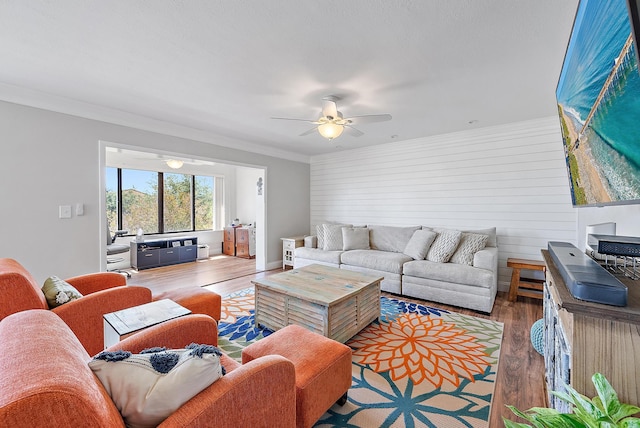 5393 SE Miles Grant Rd Unit A203, Stuart, FL 34997 - living area with wood finished floors, ceiling fan, ornamental molding, and wood walls