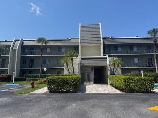 4070 Tivoli Ct Unit 302, Lake Worth, FL 33467 - dining space with a textured ceiling and light tile patterned floors