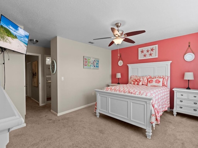 bedroom featuring light carpet, a ceiling fan, and baseboards