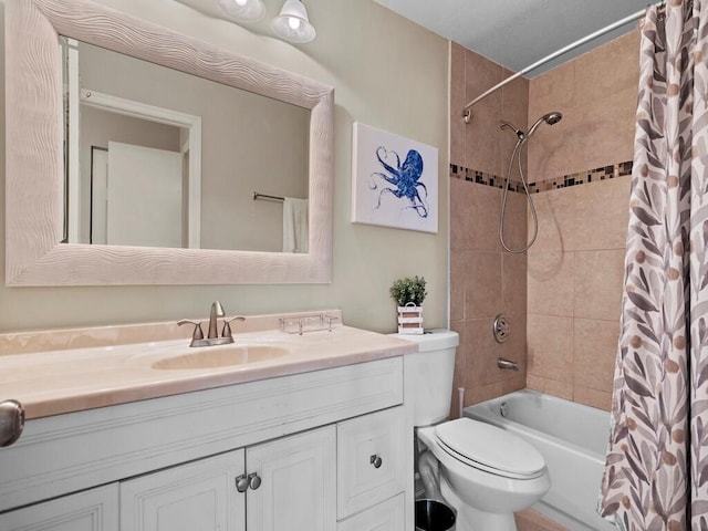 full bath featuring vanity, shower / bath combo with shower curtain, and toilet