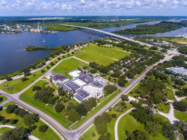 aerial view of property's location with a nearby body of water and a notable bridge