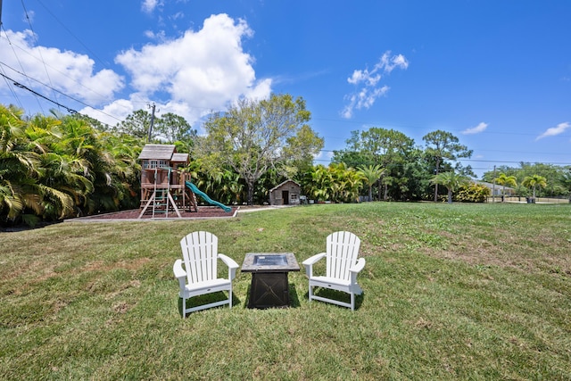 view of grassy yard with a playground