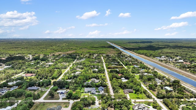 aerial view of residential area featuring a heavily wooded area