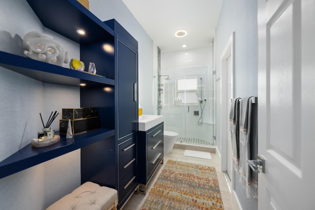 bathroom featuring a shower stall, toilet, vanity, and tile patterned floors