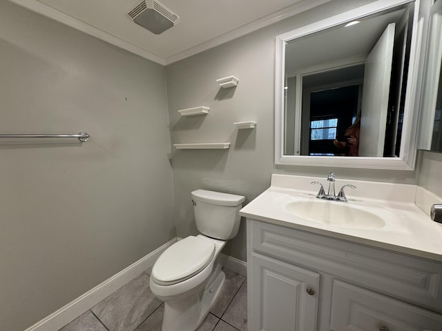 half bath featuring toilet, vanity, tile patterned flooring, and baseboards