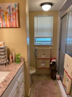3755 Via Poinciana Unit 203, Lake Worth, FL 33467 - full bath with a stall shower, vanity, and toilet