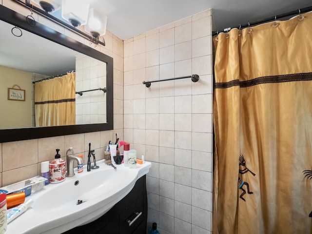 3755 Via Poinciana Unit 203, Lake Worth, FL 33467 - bathroom with tile walls, vanity, tasteful backsplash, and a shower with curtain