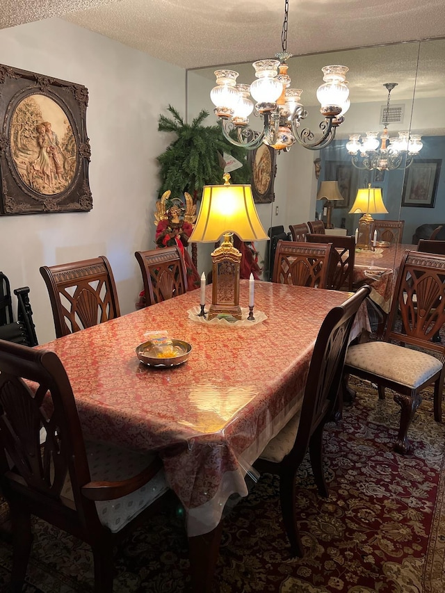 3755 Via Poinciana Unit 203, Lake Worth, FL 33467 - dining room featuring a chandelier, a textured ceiling, and carpet flooring