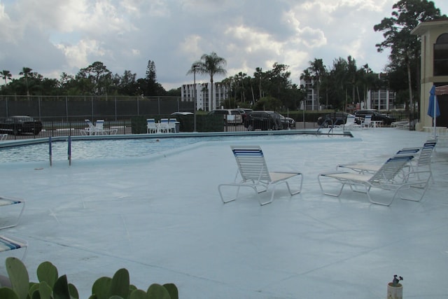 3755 Via Poinciana Unit 203, Lake Worth, FL 33467 - community pool with fence and a patio area
