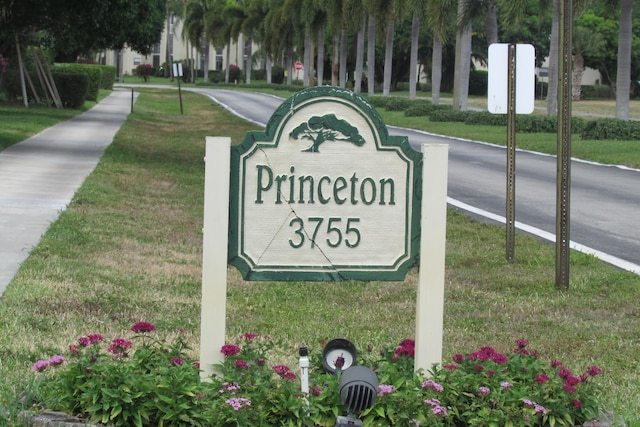 3755 Via Poinciana Unit 203, Lake Worth, FL 33467 - community sign featuring a lawn