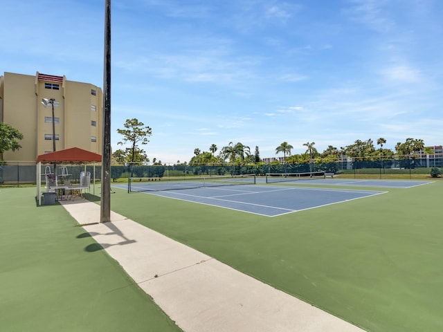 3755 Via Poinciana Unit 203, Lake Worth, FL 33467 - view of tennis court featuring fence