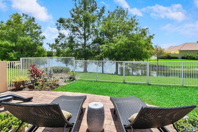 5021 Magnolia Bay Cir, Palm Beach Gardens, FL 33418 - view of yard with a water view and a patio
