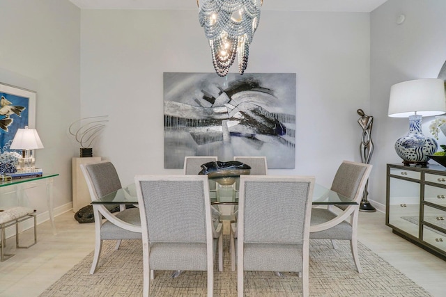 5021 Magnolia Bay Cir, Palm Beach Gardens, FL 33418 - dining room featuring a chandelier, wood finished floors, and baseboards