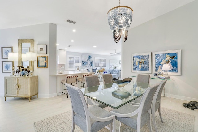 5021 Magnolia Bay Cir, Palm Beach Gardens, FL 33418 - dining space with a chandelier, light wood-style floors, baseboards, and recessed lighting