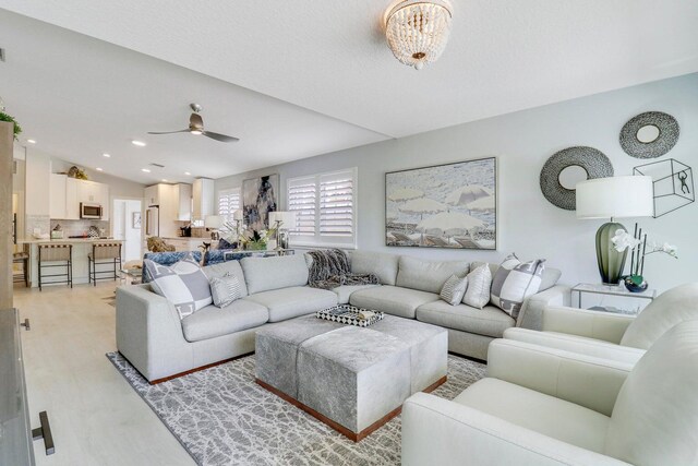 5021 Magnolia Bay Cir, Palm Beach Gardens, FL 33418 - living area featuring a ceiling fan, light wood-style floors, recessed lighting, and lofted ceiling