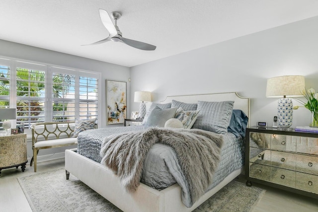 5021 Magnolia Bay Cir, Palm Beach Gardens, FL 33418 - bedroom with wood finished floors and a ceiling fan