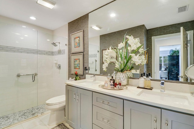 5021 Magnolia Bay Cir, Palm Beach Gardens, FL 33418 - bathroom with a stall shower, toilet, double vanity, tile patterned floors, and recessed lighting