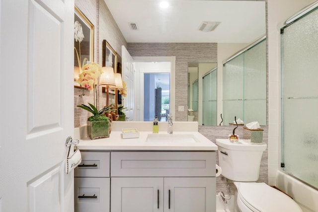 5021 Magnolia Bay Cir, Palm Beach Gardens, FL 33418 - full bathroom with toilet, vanity, and shower / bath combination with glass door