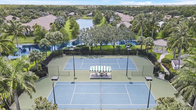 5021 Magnolia Bay Cir, Palm Beach Gardens, FL 33418 - view of tennis court featuring a gazebo, fence, and a water view
