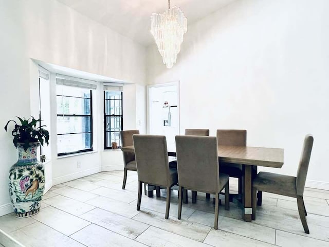 1855 Primrose Ln, Wellington, FL 33414 - dining area with a chandelier and baseboards