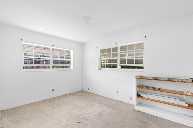 310 SW 2nd St, Boca Raton, FL 33432 - spare room with baseboards and carpet floors