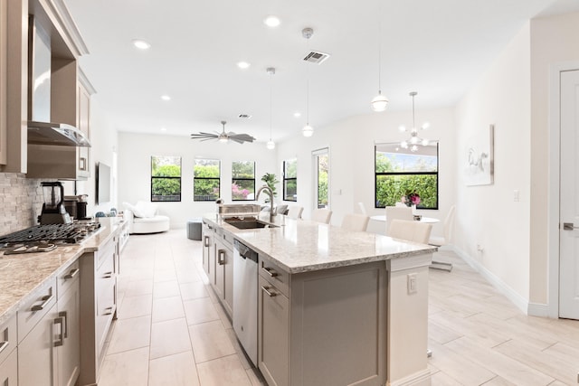 8640 E Baypoint Cir, Parkland, FL 33076 - kitchen with a sink, stainless steel appliances, backsplash, open floor plan, and recessed lighting
